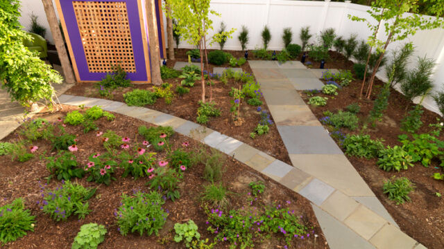 After: Bluestone paths crossing in backyard
