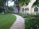 Define your lawn with a stone walkway perimeter