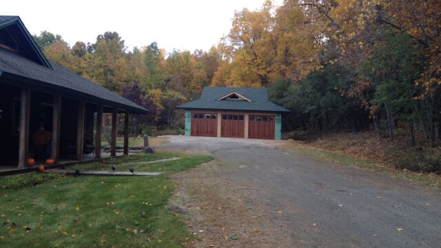 Before: Driveway was too wide, washed out, view was focused on garage, and no existing landscaping