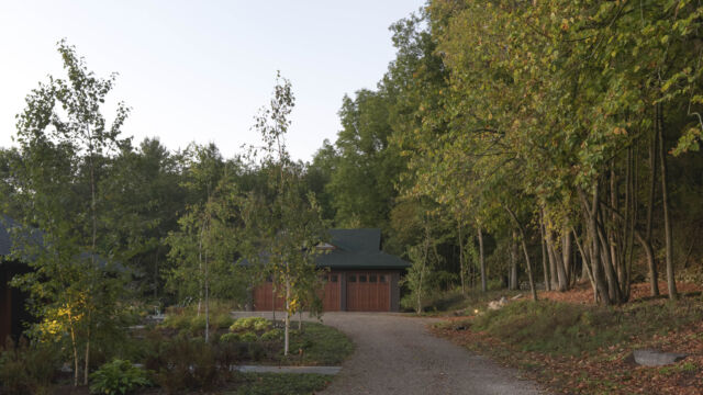 After: By narrowing and curving the driveway away from the house, we re-focused the view and gave more space for plantings.