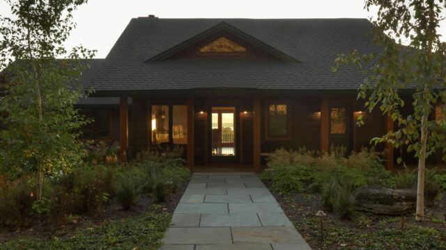After: Bluestone walkway, gravel drip edge, woodland garden.