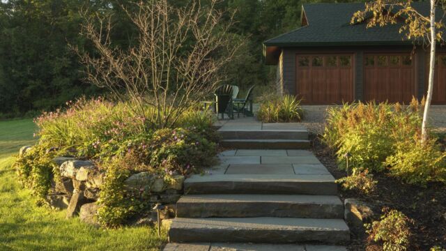After: Final connection with bluestone steps and a walkway, planted on either side.