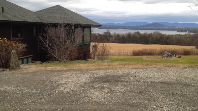 Before: parking area with a beautiful view of Lake Champlain and the Green Mountains.