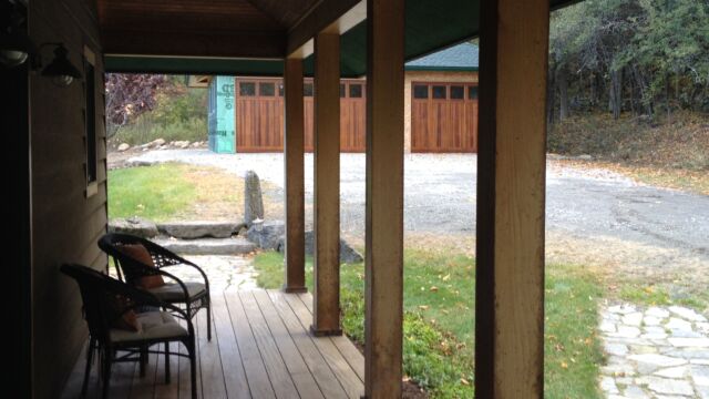 Before: View of front porch and garage from the front door.